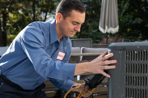 Technician completing a routine AC tune-up